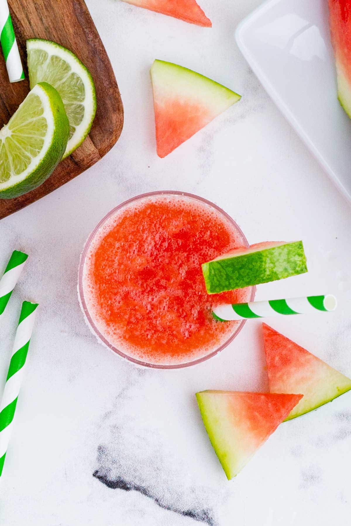 An overhead shot of watermelon margarita in a glass.