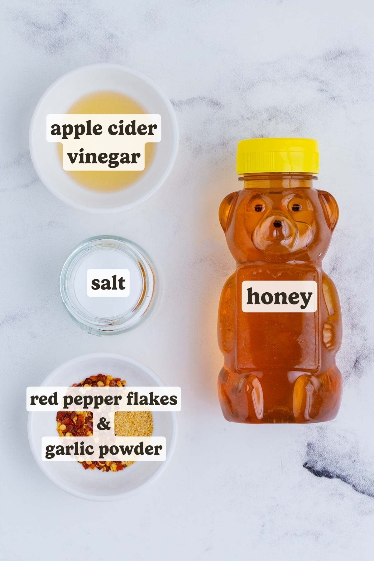 Honey, red pepper flakes, garlic, and apple cider vinegar are the ingredients for hot honey.