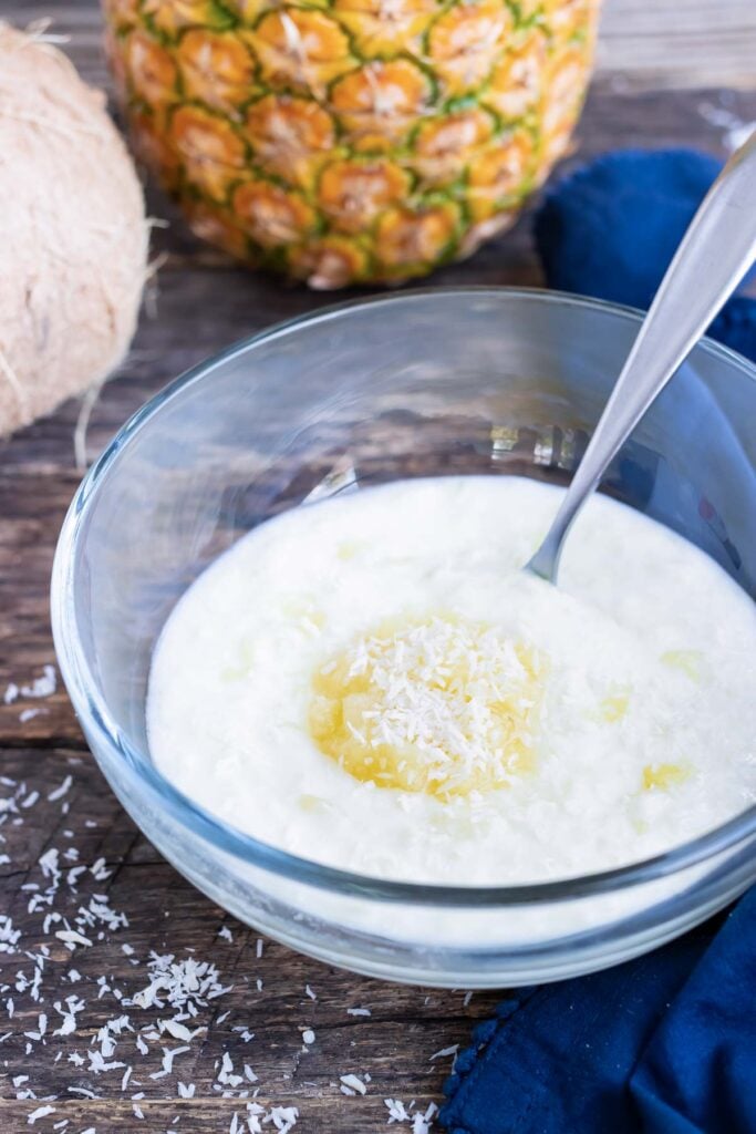 Red Lobster's coconut shrimp dipping sauce recipe in a clear glass bowl with a spoon.