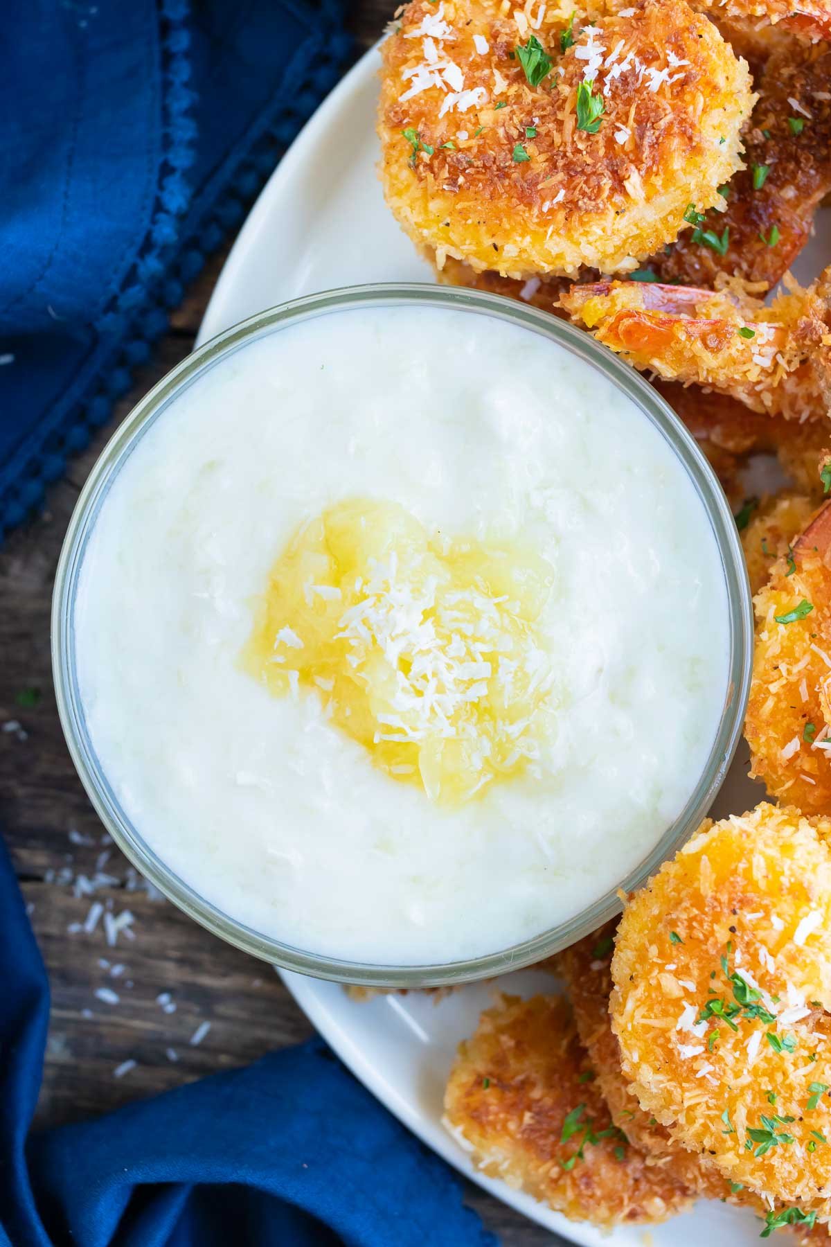 A pineapple coconut dipping sauce for coconut shrimp.