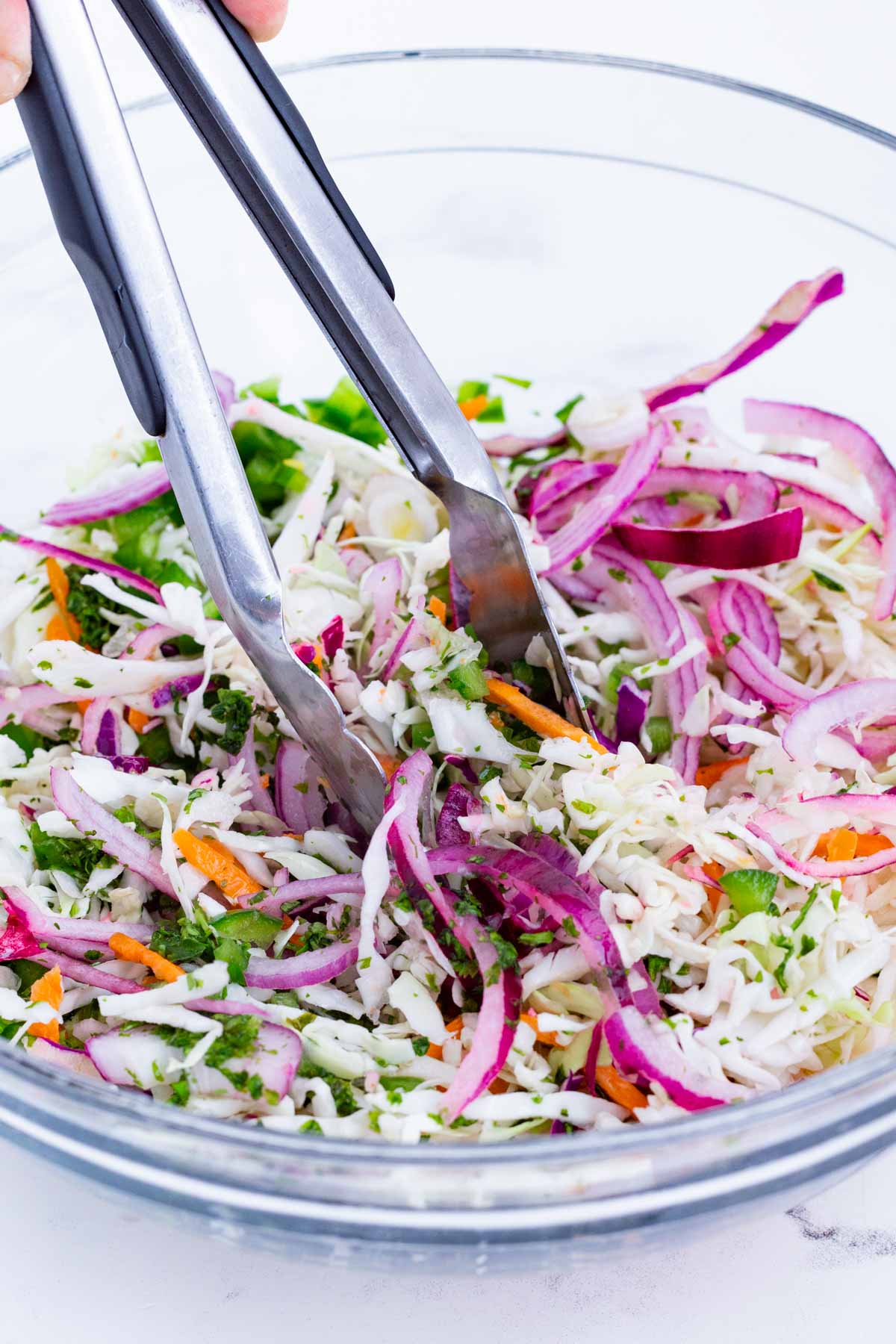 Fish slaw is mixed up.