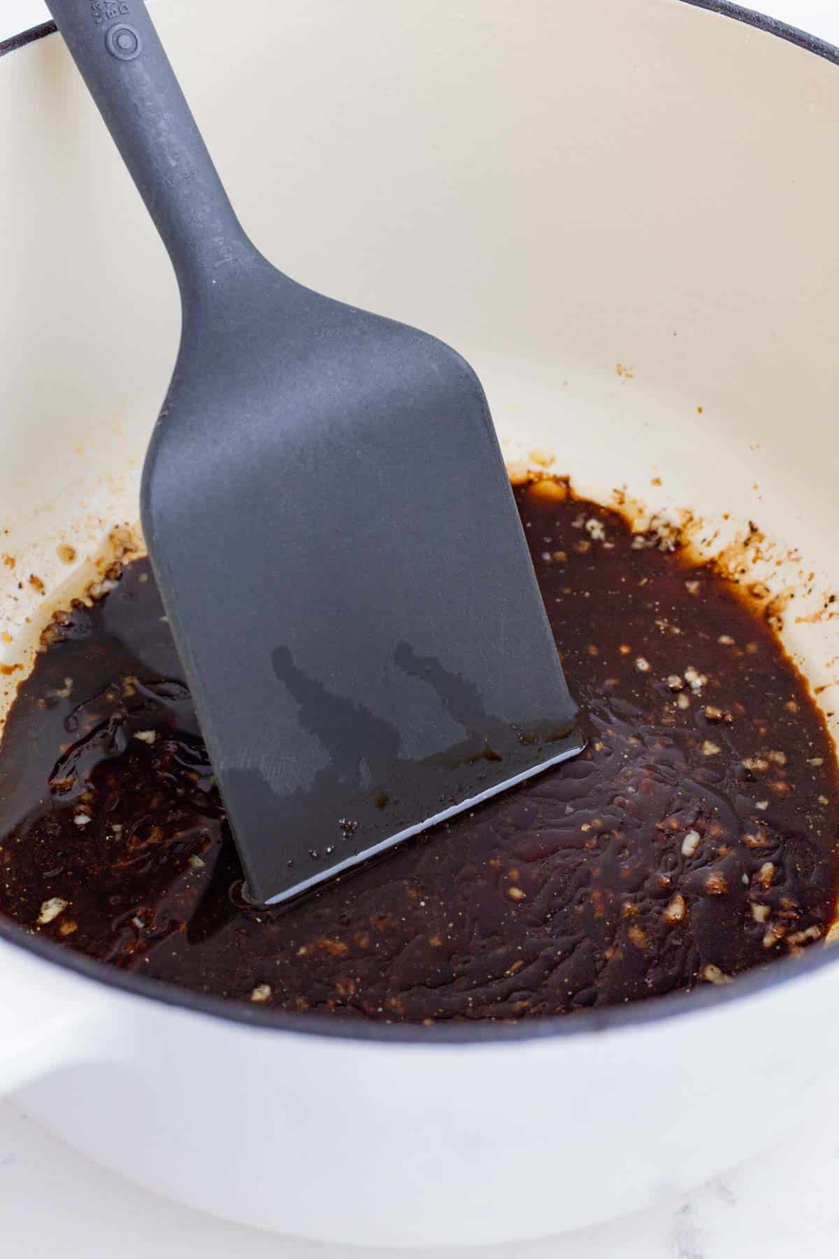 Balsamic vinegar and brown sugar are added to make a reduction.