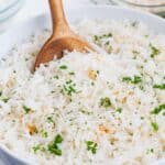Simply cook rice in coconut milk then top with toasted coconut and basil for a delicious side.