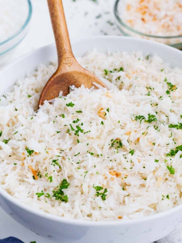 Simply cook rice in coconut milk then top with toasted coconut and basil for a delicious side.