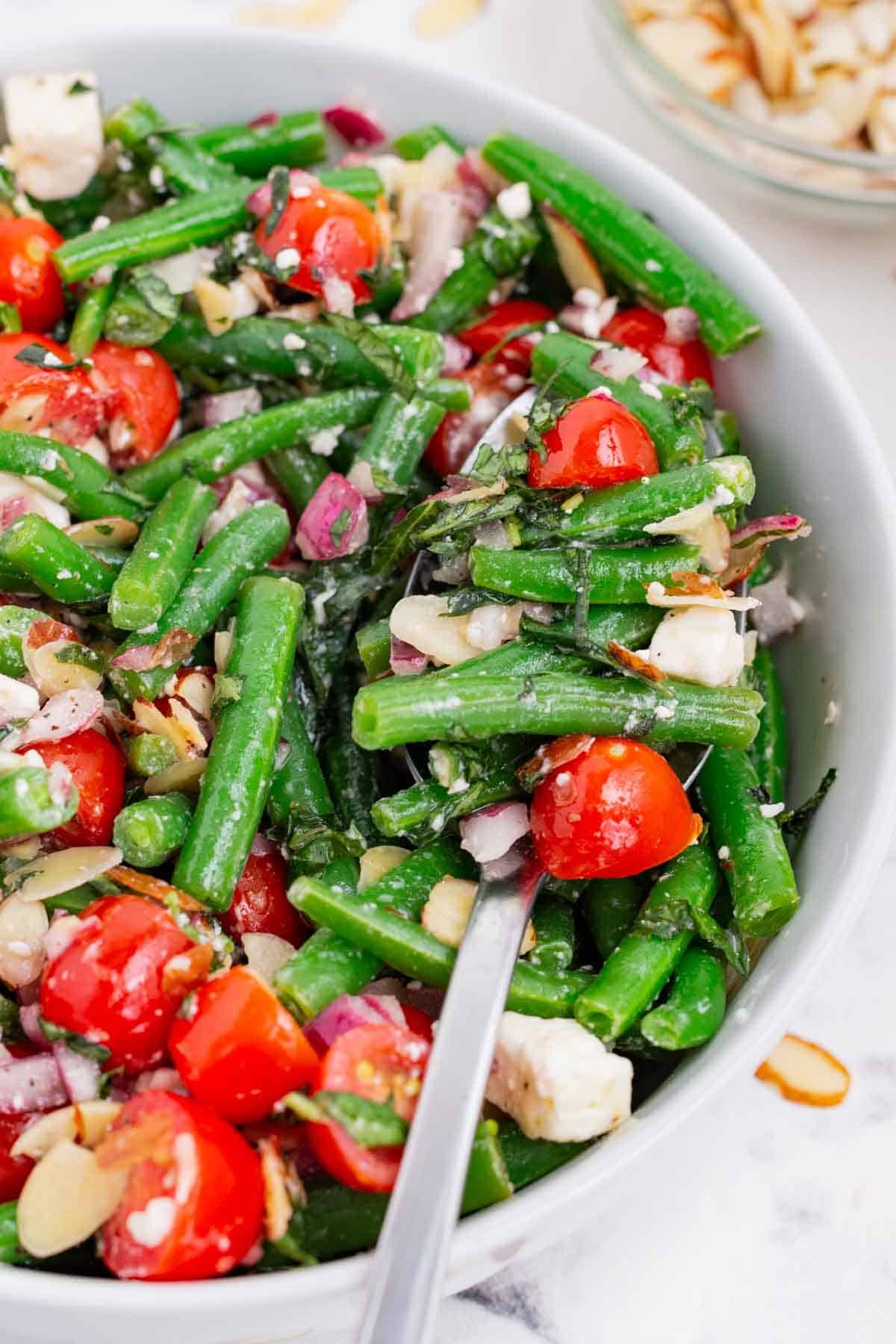 Green bean salad is full of healthy and refreshing ingredients.