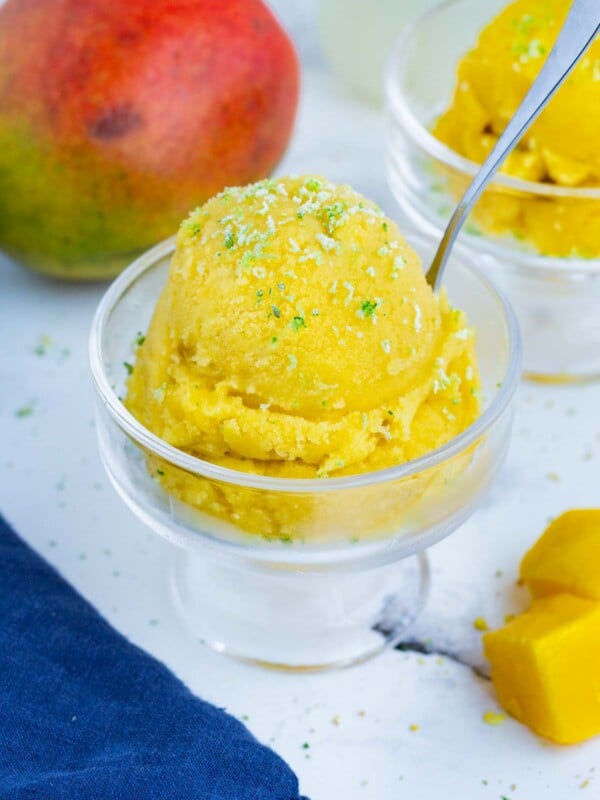 Mango sorbet only needs frozen mango, citrus, and sweetener to make.
