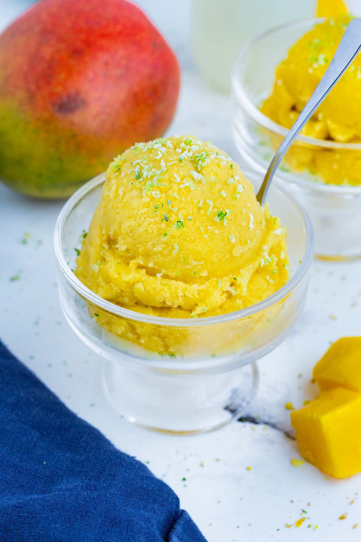 Mango sorbet only needs frozen mango, citrus, and sweetener to make.