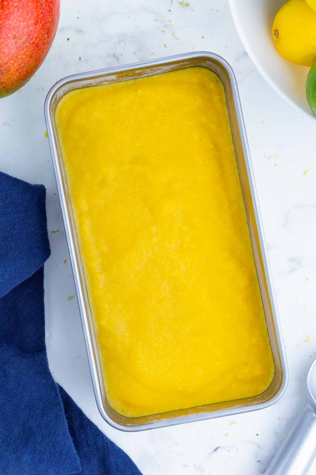 Blended sorbet is poured into a loaf pan to freeze.