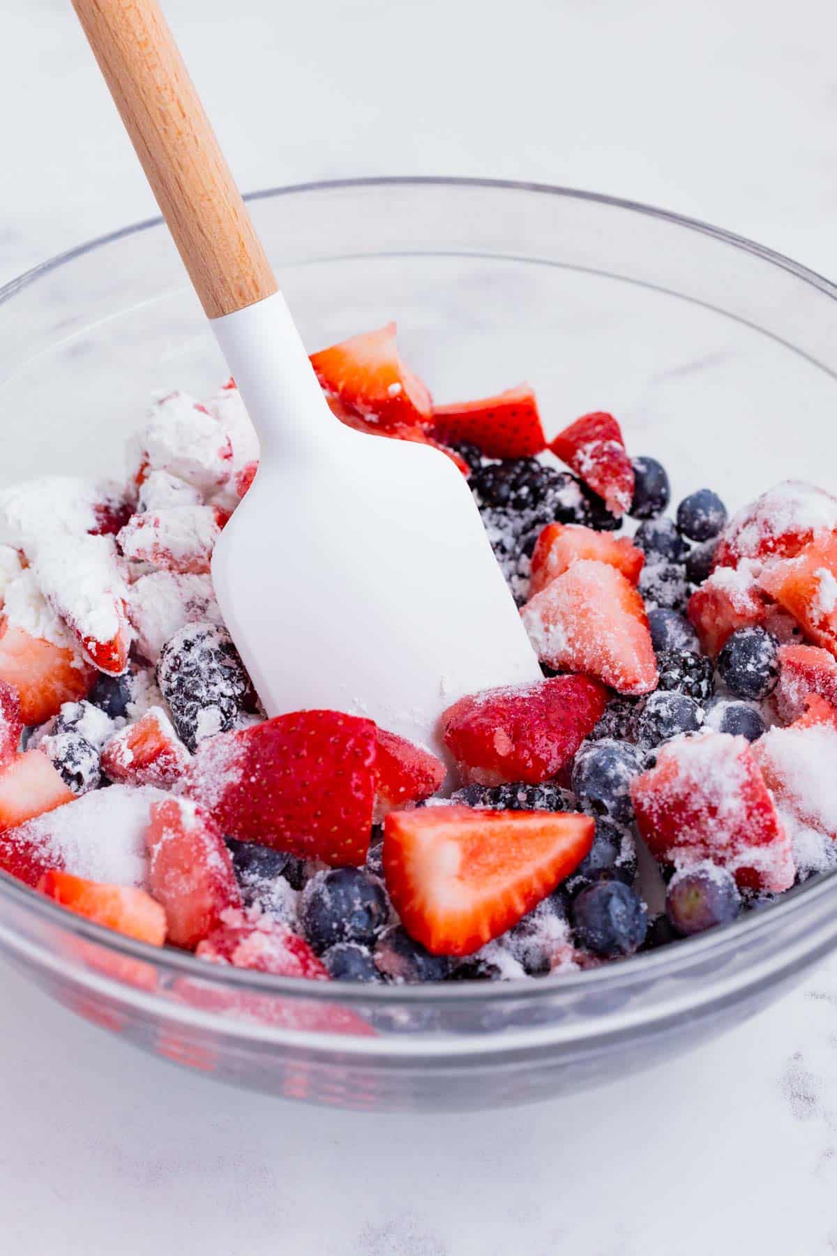 Cornstarch and sugar are added to the berries.