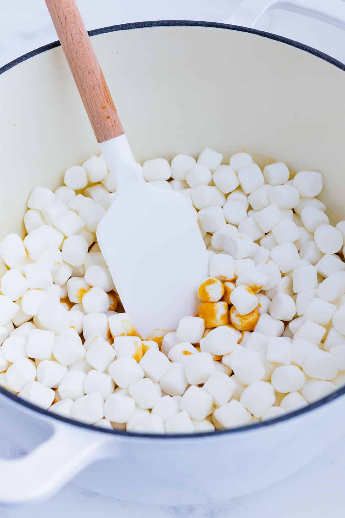 Mini marshmallows are mixed into the butter mixture.