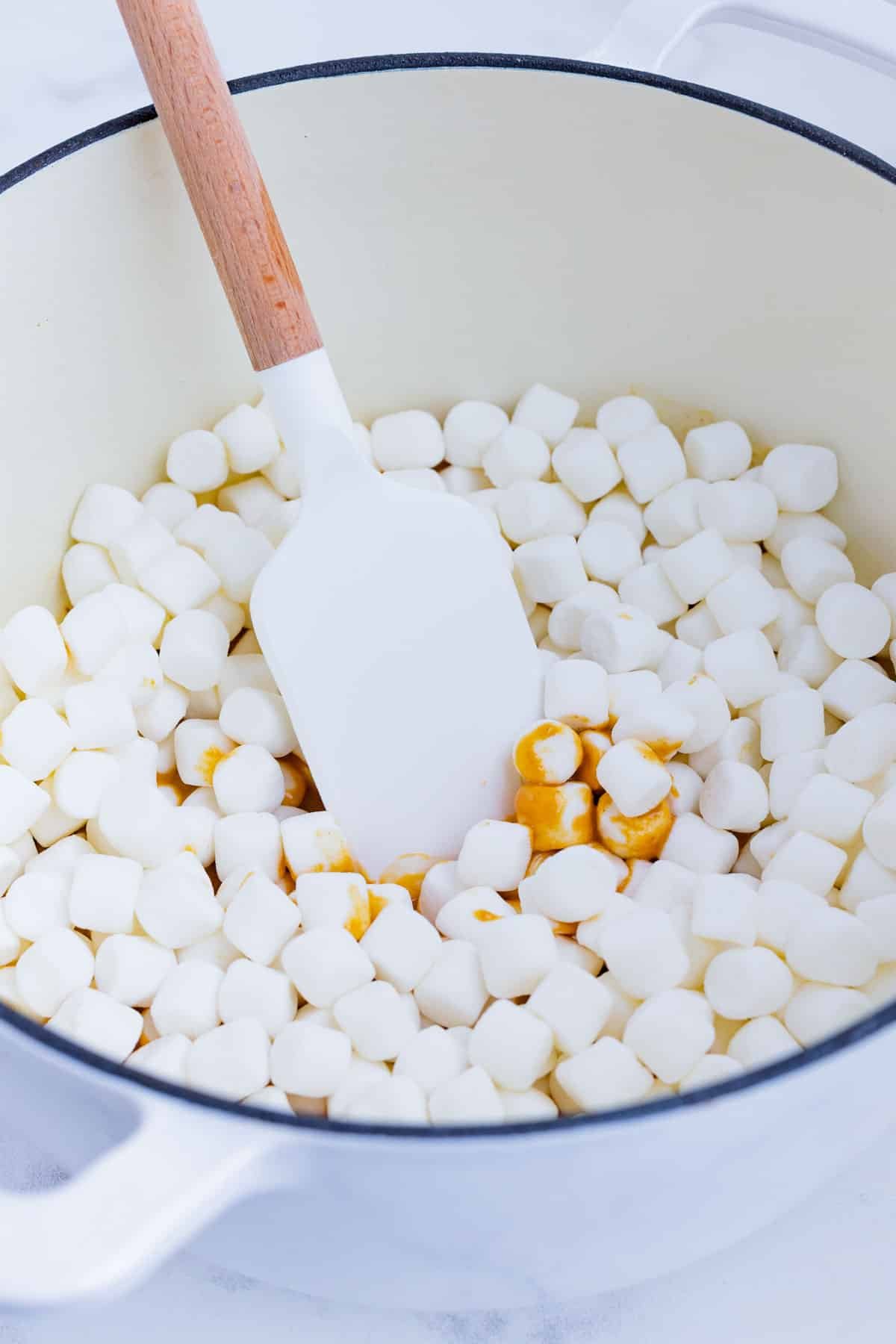 Mini marshmallows are mixed into the butter mixture.