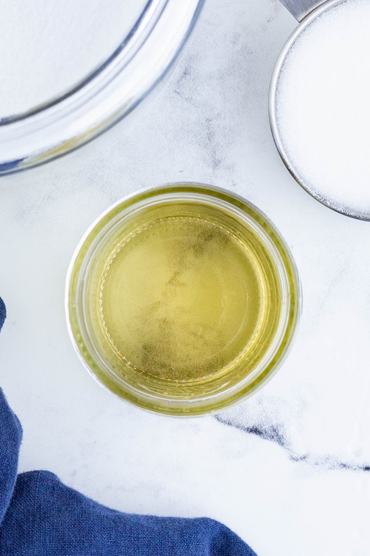 An overhead shot of simple syrup kept in a glass jar.