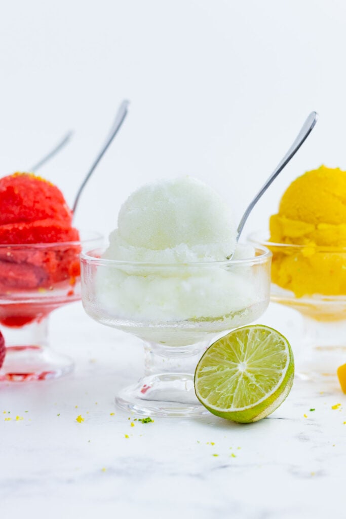 Cups of different types of sorbet are in a row.
