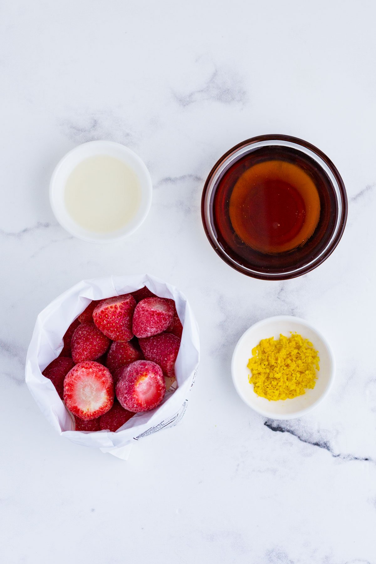 Frozen strawberries, citrus, and simple sugar are the ingredients for this recipe.