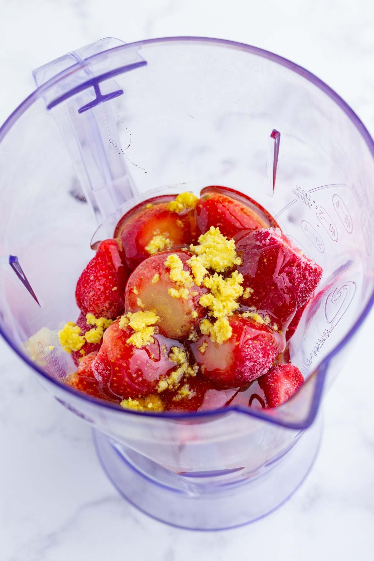 Sorbet ingredients are added to a blender.