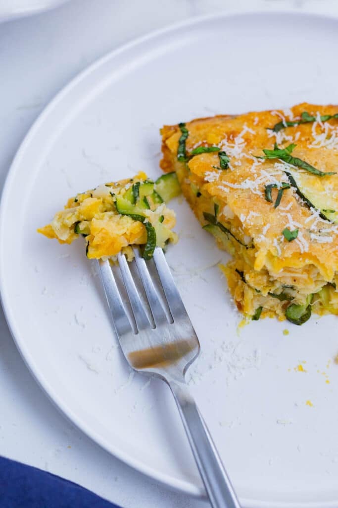 Zucchini pie is a savory and cheesy side dish you can easily whip up at home.