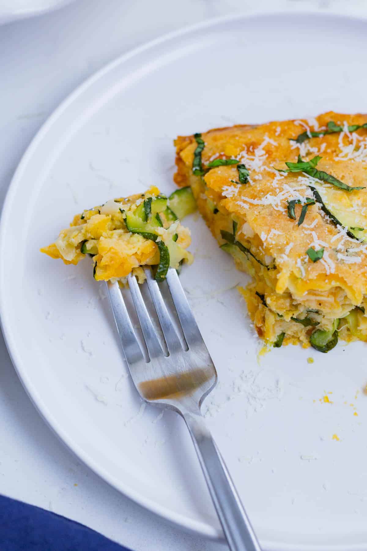 Zucchini pie is a savory and cheesy side dish you can easily whip up at home.