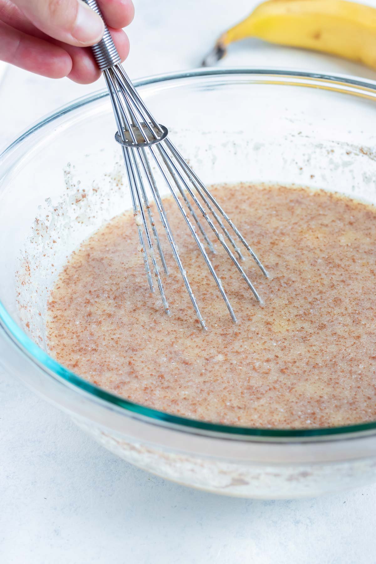 All ingredients except the oats, berries, and nuts are whisked together.