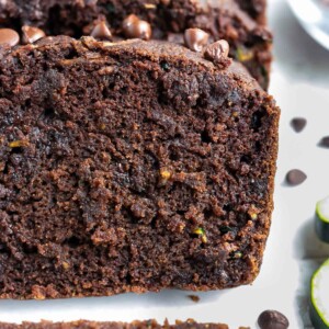 A close-up of super moist and rich chocolate zucchini bread that is gluten-free and vegan.