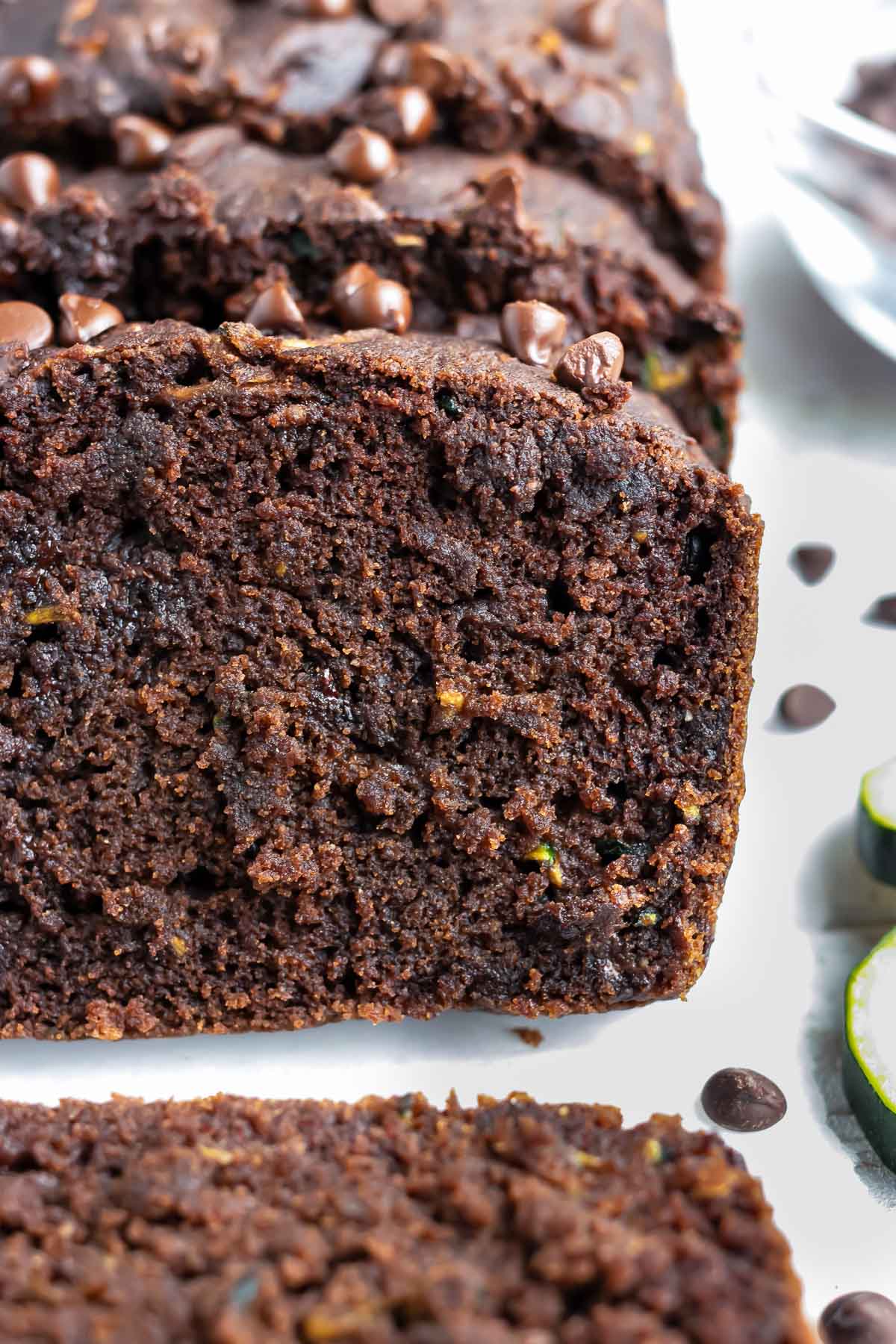 A close-up of super moist and rich chocolate zucchini bread that is gluten-free and vegan.