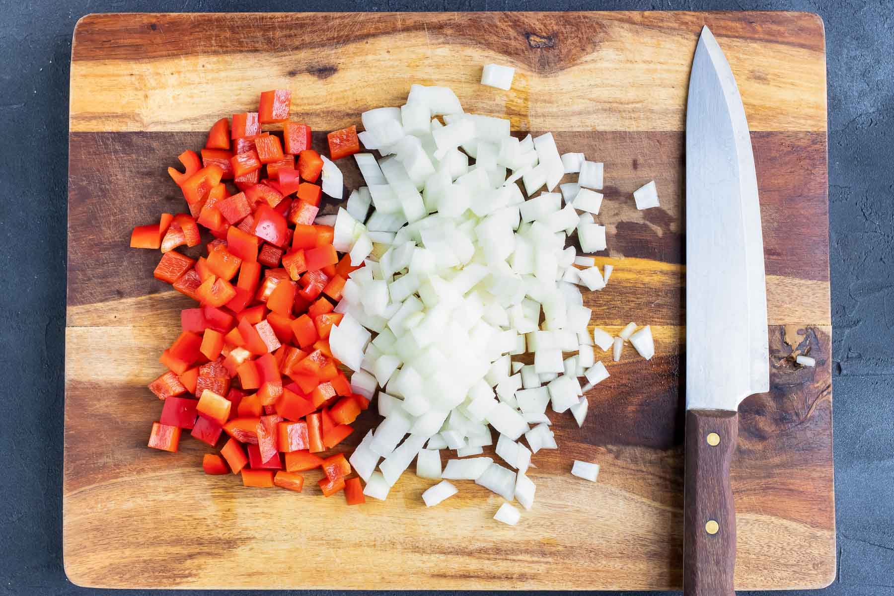 Diced onion and bell peppers for a gallo pinto recipe.