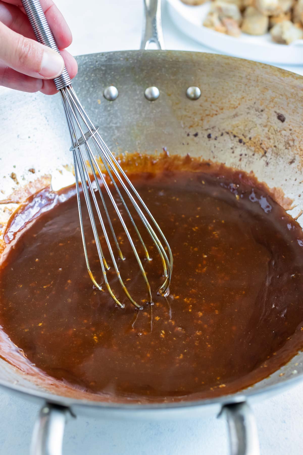 The sauce ingredients are mixed together on the stove.