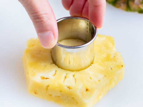 A metal cookie cutter is used to cut rings.