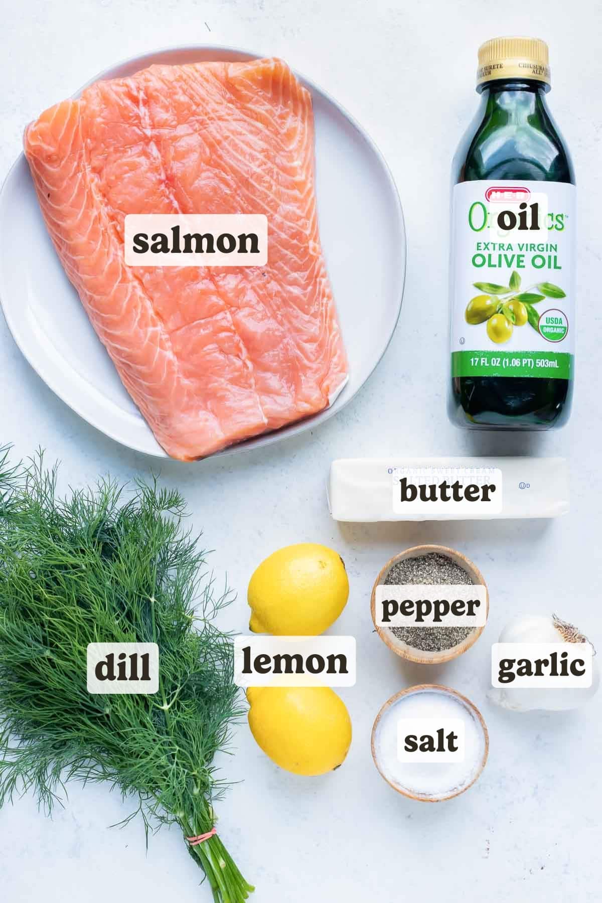 Oil, butter, lemon, fresh dill, garlic, salmon, salt, and pepper are the ingredients in this baked salmon recipe.