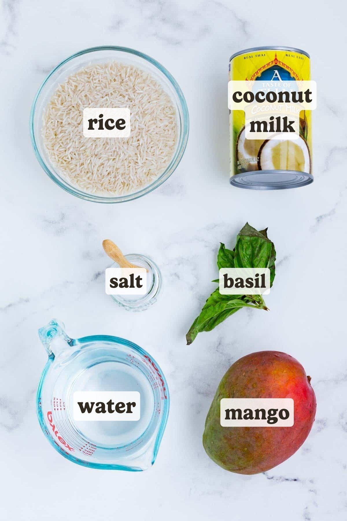 Rice, coconut milk, water, basil, and mango are the ingredients for this mango coconut rice recipe.