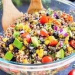 A Mexican Quinoa Salad with avocado is served in a bowl with a homemade cilantro lime dressing.