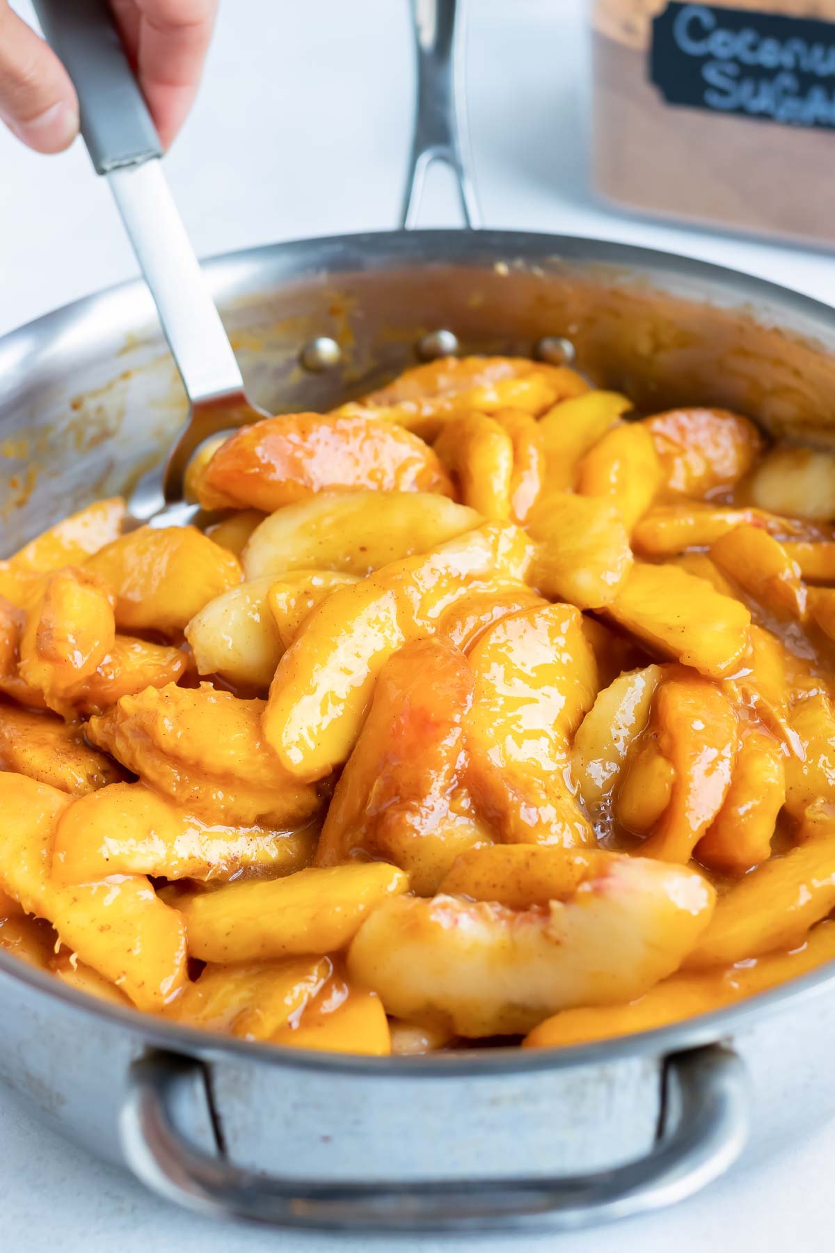 The peach filling is cooked on the stovetop.