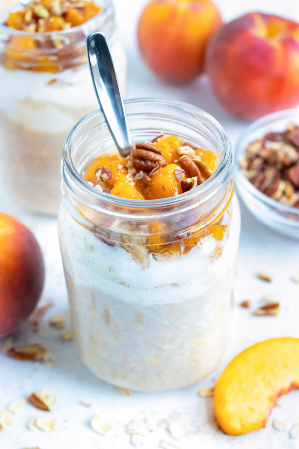 Peach cobbler overnight oats are made in a mason jar for an easy, on-the-go breakfast or snack.