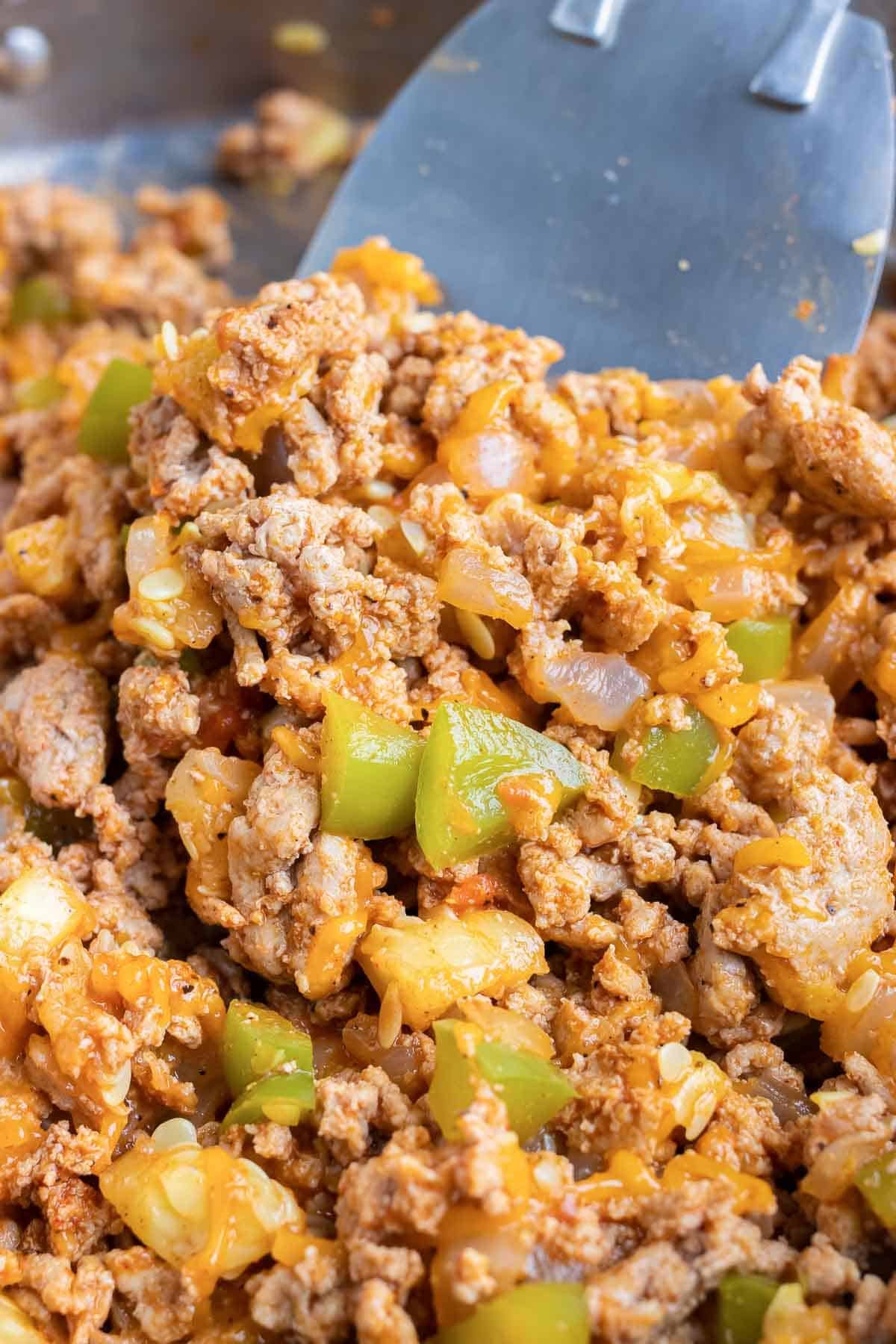 Ground meat taco filling with cheese and bell peppers.