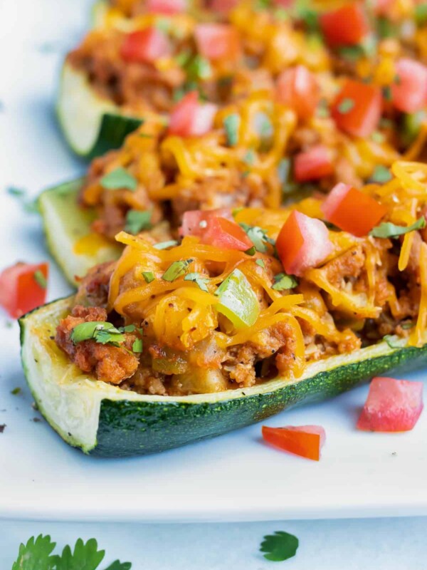 Low-carb and healthy zucchini boat recipe with a Mexican taco filling.