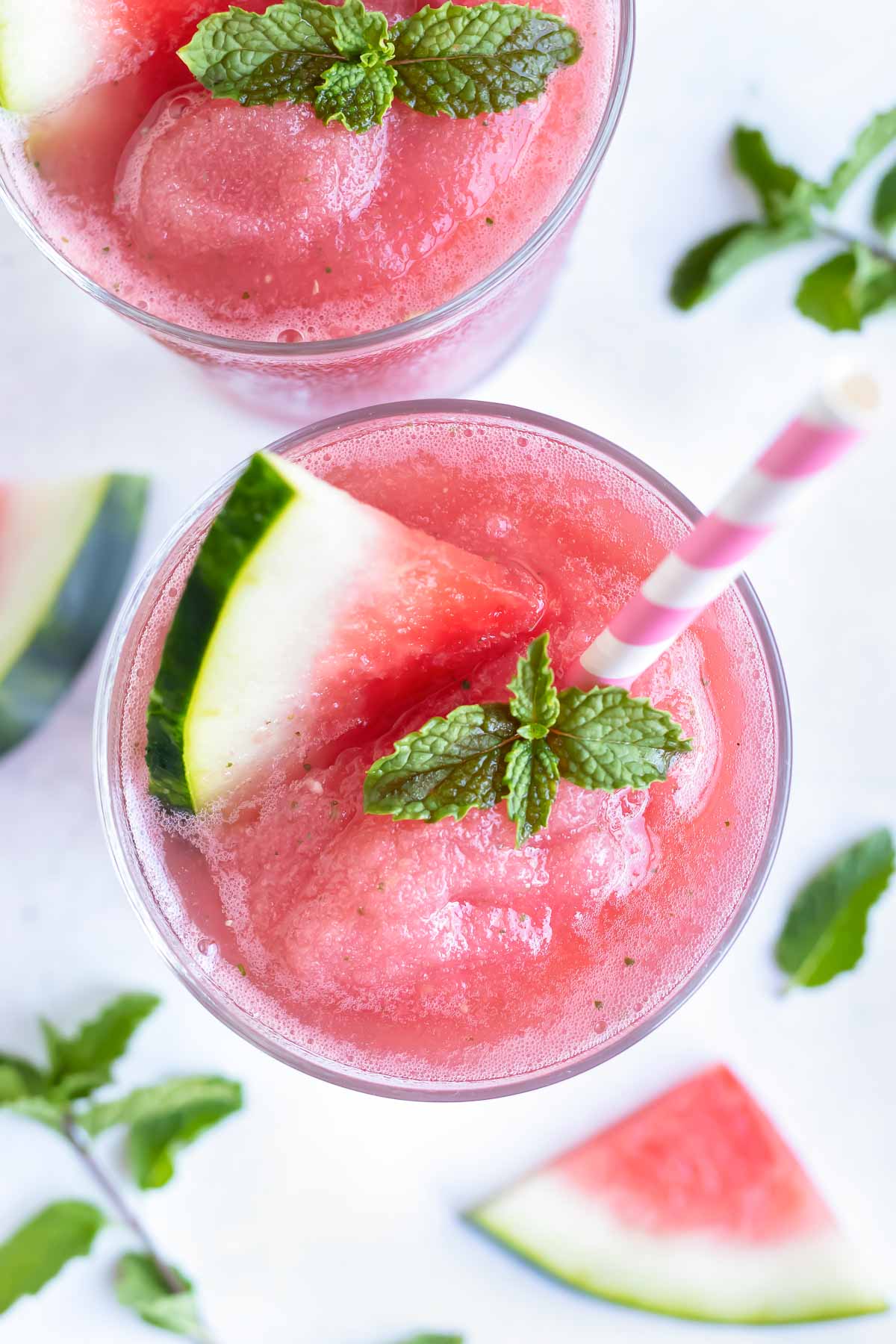 Two glasses of frosé made with watermelon and mint for an easy frozen drink recipe.