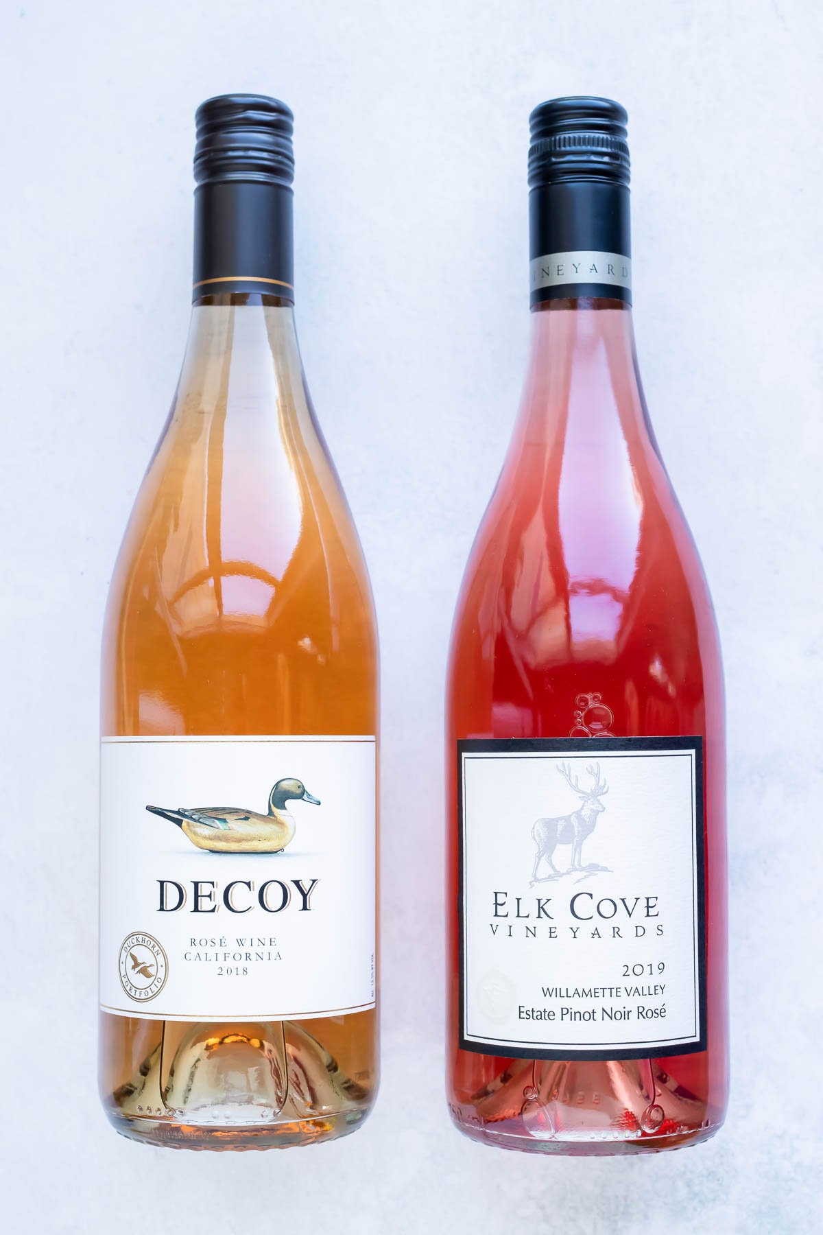 Two different types of rosé wine to be used in a frozen drink recipe.