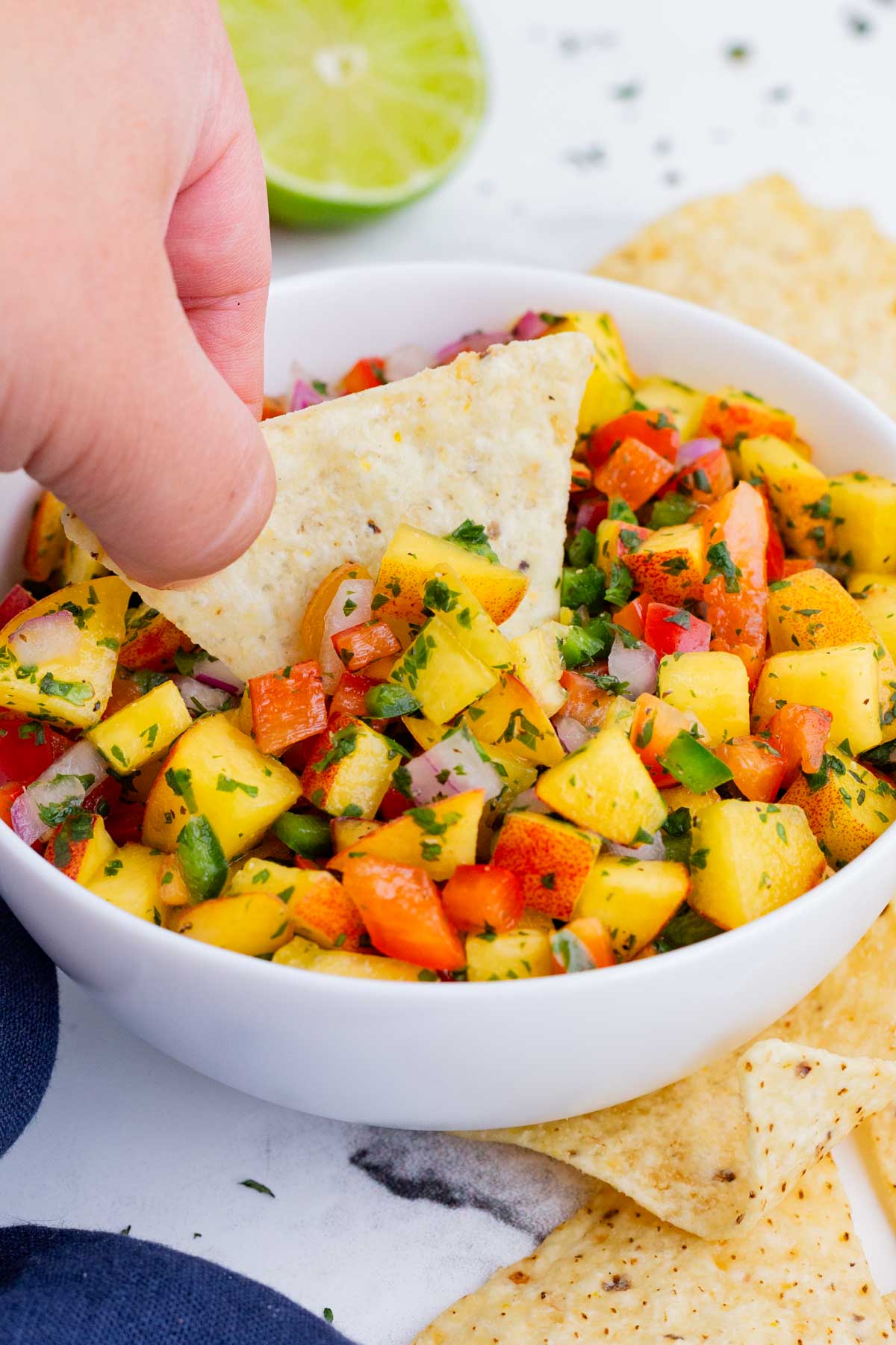 Peach Salsa is a sweet and savory dip and topping you can enjoy anytime.