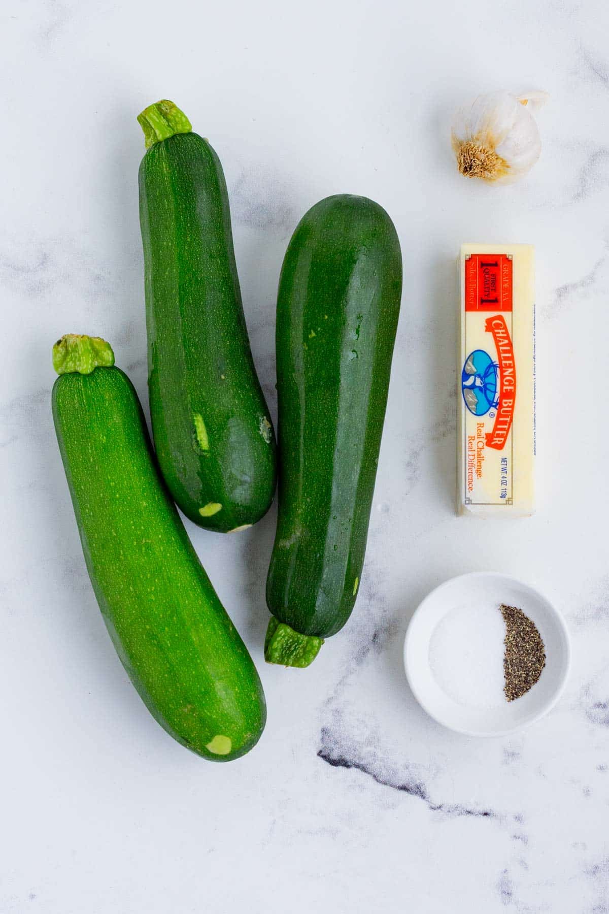 Zucchini, butter, garlic, and seasonings are the ingredients for this dish.