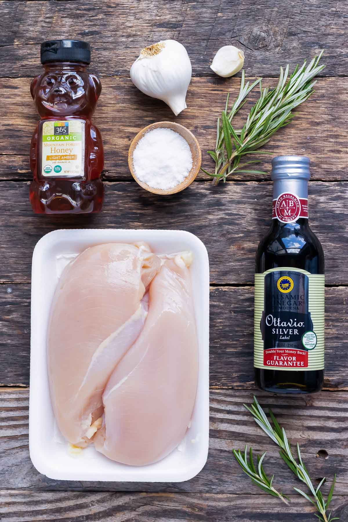 Chicken breasts, honey, balsamic vinegar, garlic, and rosemary as the ingredients for a balsamic glazed chicken breast recipe.