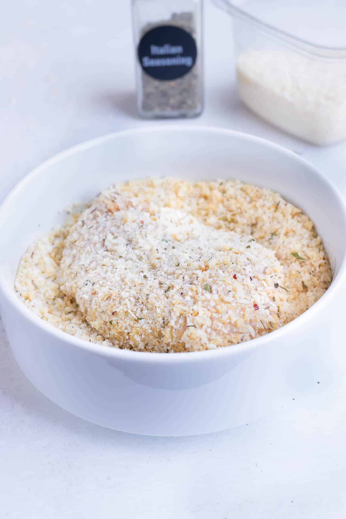 Chicken parmesan recipe has chicken crusted in a gluten-free breadcrumb and parmesan mixture.