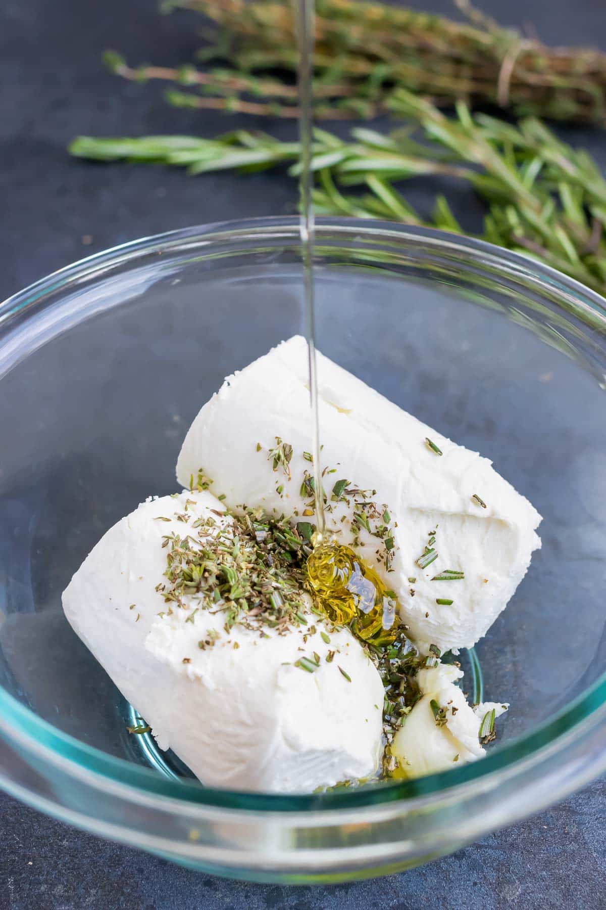 The ingredients are added to a glass bowl.