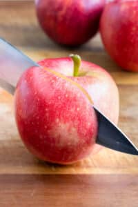 Using a large knife, cut the apple on all sides of the core.
