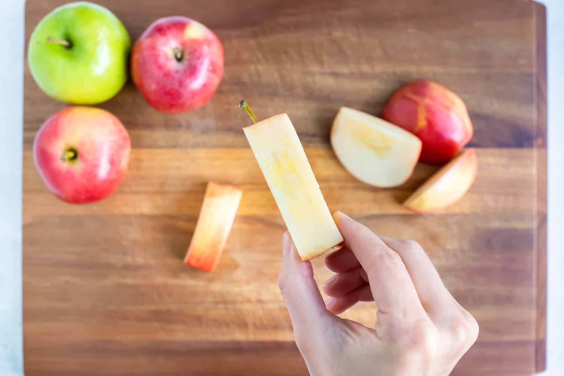 All sides of an apple cut with the core by itself.
