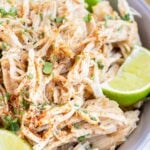 Tender, shredded chicken breasts in a bowl.