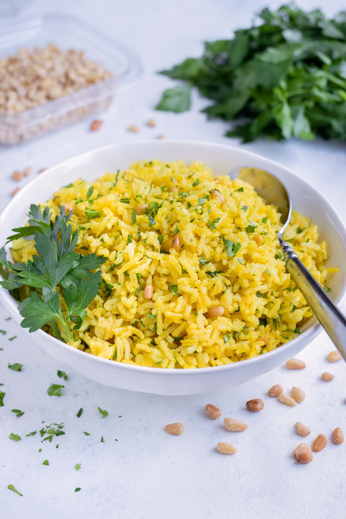 A white bowl is used to serve Greek Pilaf.