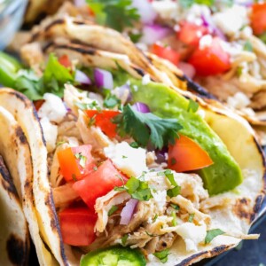 Learn how to make shredded chicken tacos in either the Instant Pot or the Crock-Pot.