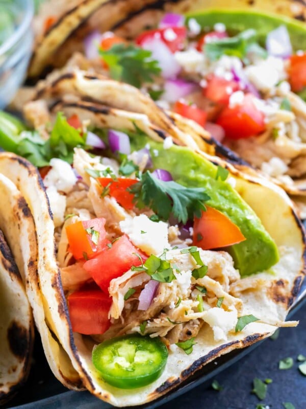 Learn how to make shredded chicken tacos in either the Instant Pot or the Crock-Pot.