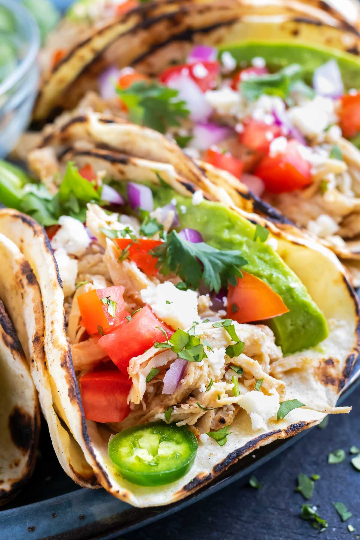 Learn how to make shredded chicken tacos in either the Instant Pot or the Crock-Pot.