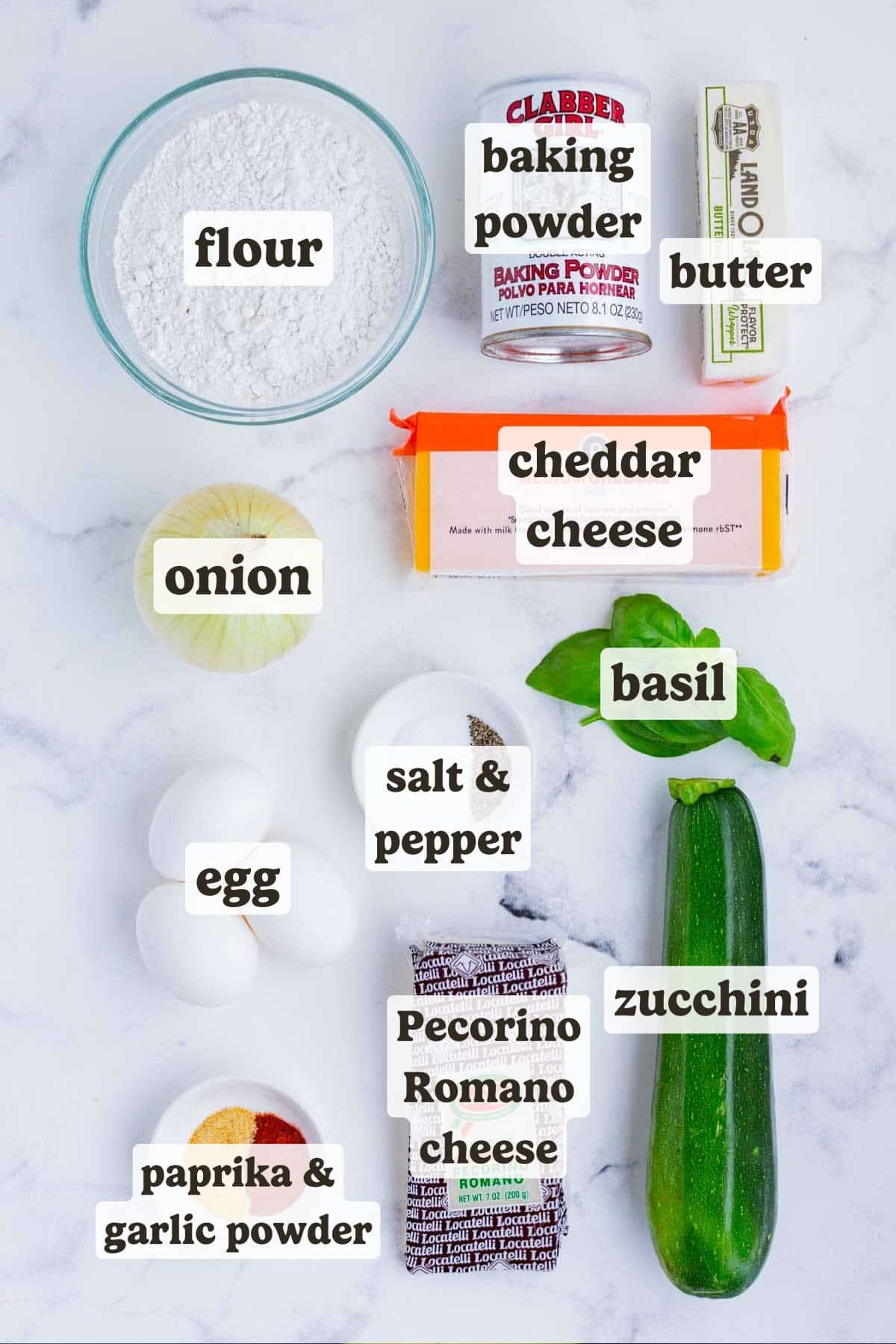 Zucchini, cheese, basil, eggs, flour, and seasonings are the ingredients for this dish.