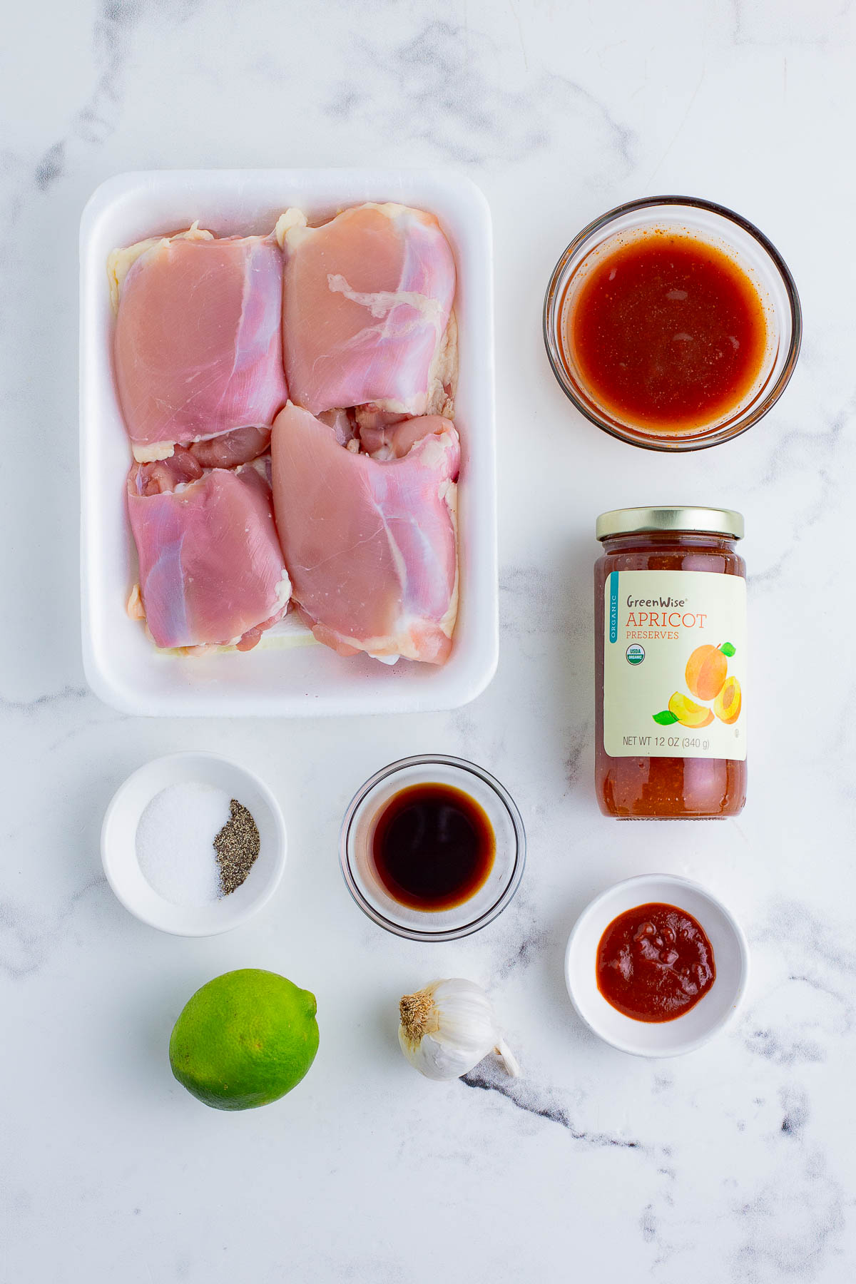 Chicken thighs, bbq sauce, apricot preserves, and seasonings are the ingredients for this dish.